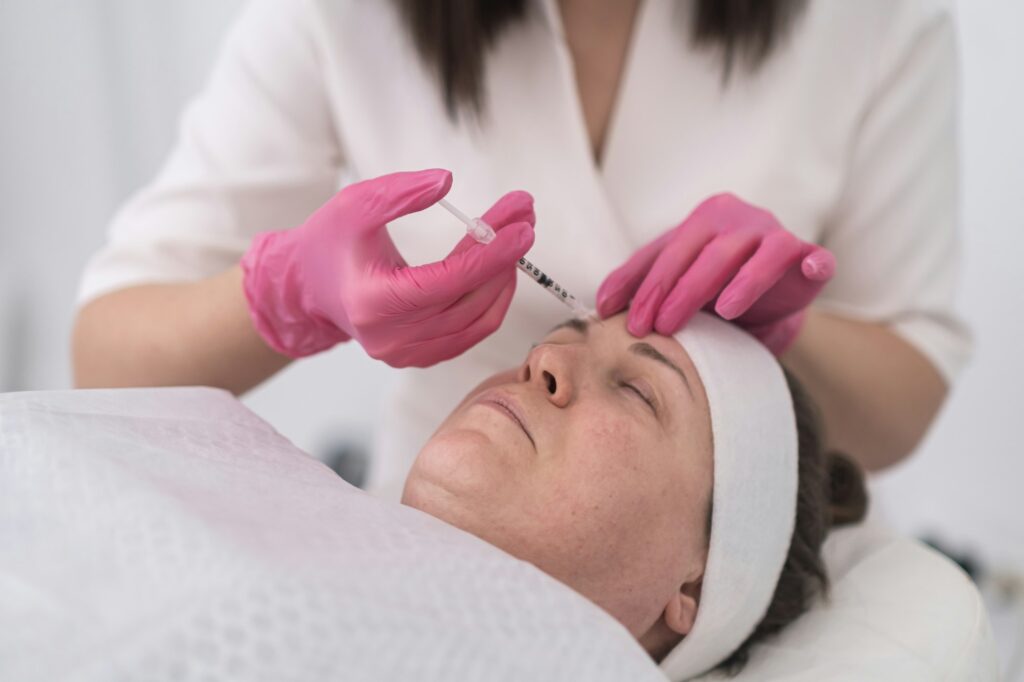 anti-aging hyaluronic acid injection expertl beautician. close-up syringe filled with the filler.